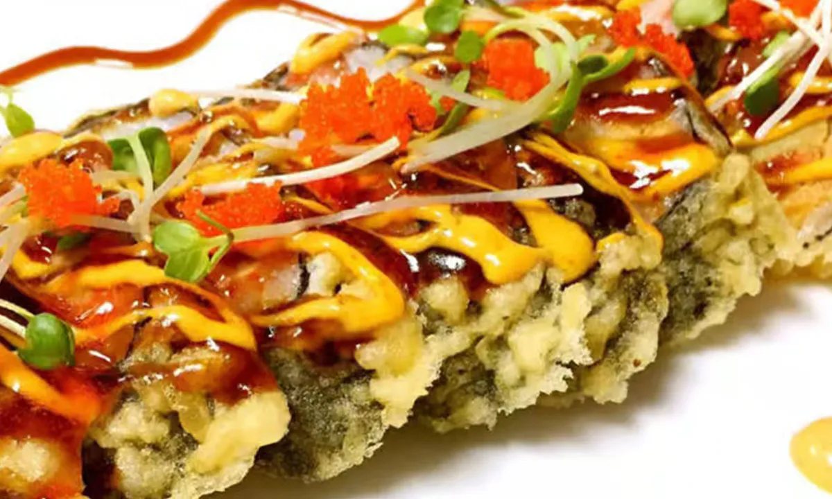 Godzilla Roll with spicy sauce, fish roe and greens